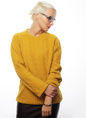 Young blond woman wearing yellow sweater