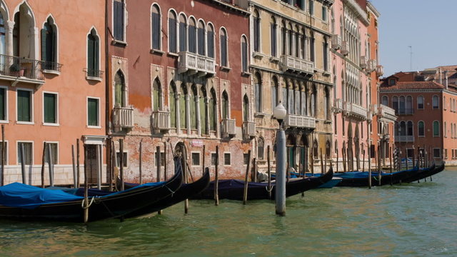 Gondolas moored along a canal in Venice, Italy