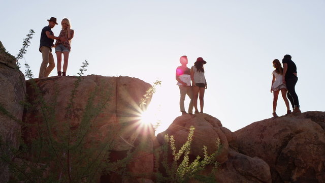Couples on top of rock