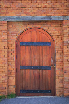 Wood door in red brick wall.
