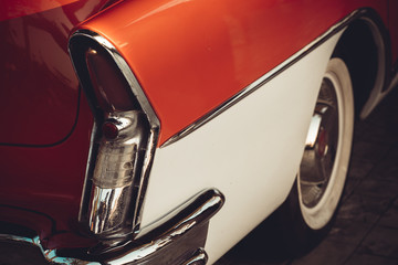 A classic red and white american car 