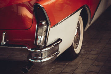 A classic red and white american car 