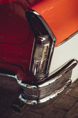 A classic red and white american car 