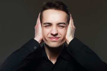 Obraz premium man covers his ears