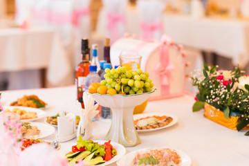 Different tasty snacks for wine on luxury banquet table