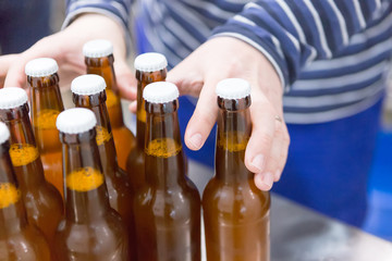 Man taking craft beer bottles