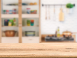 Obraz na płótnie Canvas wooden counter top with kitchen cabinet background