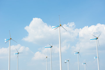 Eco energy - wind turbines ,blue sky background