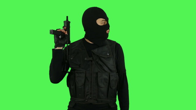 Terrorist with gun on green screen