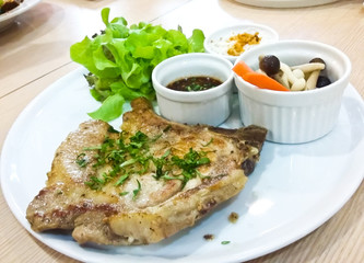 Thai style pork steak served with spicy sauce