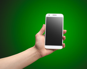hand holding the phone in a green background