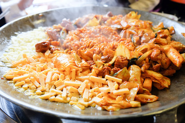 Fried Kim Chi with cheese, pork, egg, vegetables and noodles, Traditional Korean food.