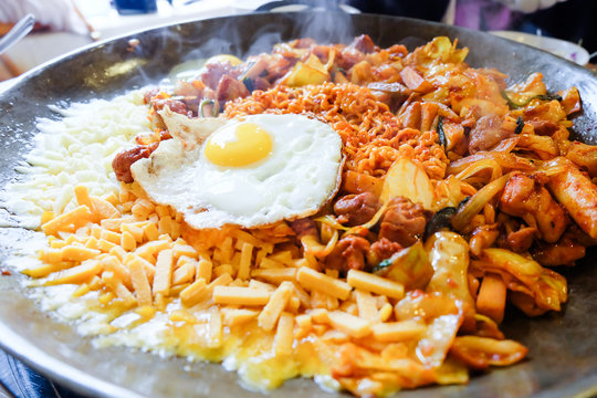 Fried Kim Chi with cheese, pork, egg, vegetables and noodles, Traditional Korean food.