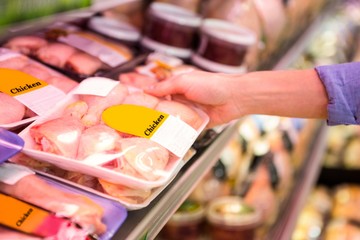 Smiling woman taking meal in the aisle