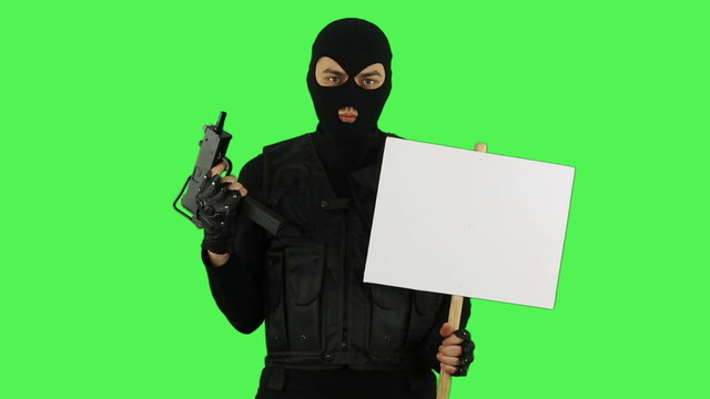 Terrorist with sign on green screen