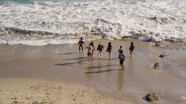 Group of young people together at beach