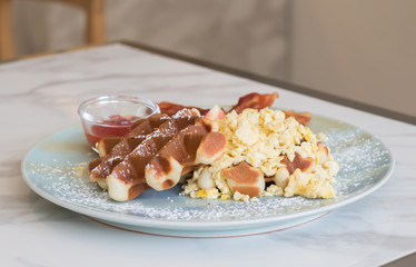 Waffle, egg and bacon for breakfast