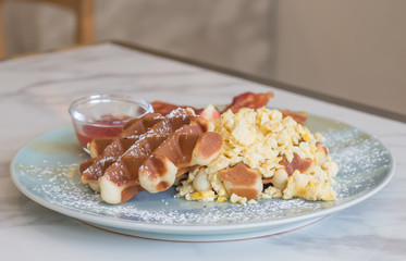 Waffle, egg and bacon for breakfast