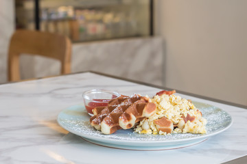 Waffle, egg and bacon for breakfast