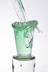 Green drink poured into a glass
