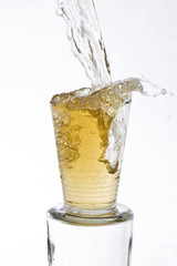 Tea colored drink poured into a glass