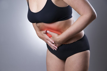 Fototapeta premium Woman with abdominal pain. Pain in the human body