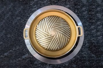 Fototapeta na wymiar brass grilling pan for Korean style BBQ