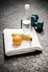 Fruit, water and dumbbells