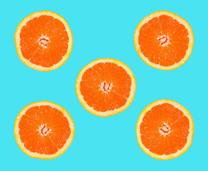 slices of grapefruit on a blue background