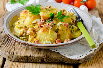 Fried potatoes with ham and pickles