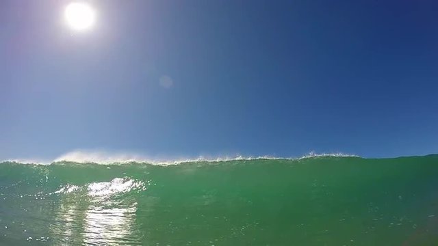 Green Water Surfing Wave Breaking At Beach Pov 