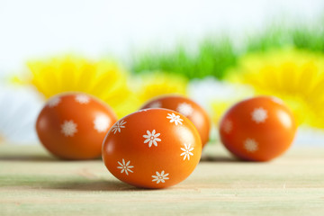 Orange Easter eggs on nature background