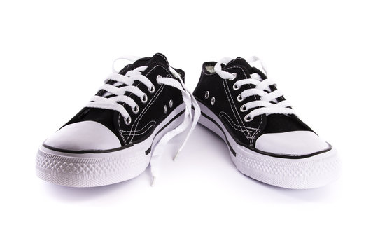 brand new black and white tennis shoes isolated on white background