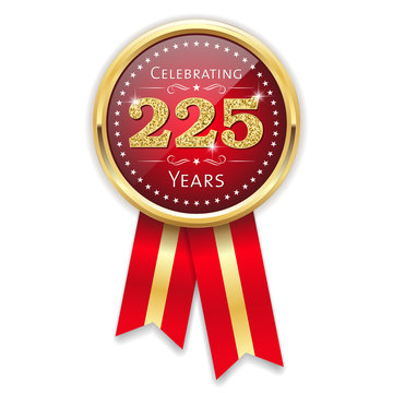 Red celebrating 225 years badge, rosette with gold border and ribbon