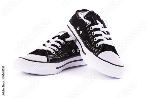 "brand new black and white tennis shoes isolated on white background