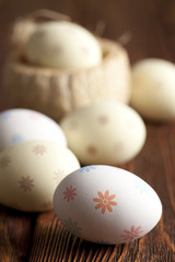 Patterned Easter eggs on wooden table