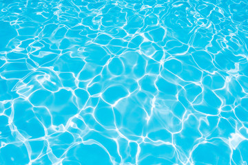 Beautiful Gentle wave in swimming pool with sun reflection