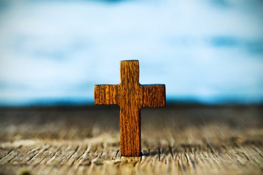 christian cross on a wooden surface