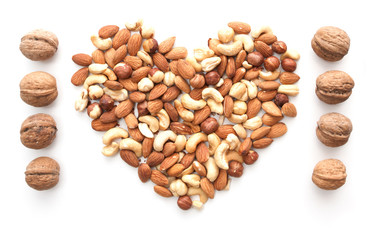 isolated nuts heart shape and walnut raw