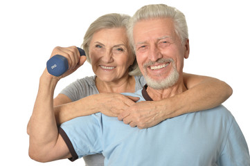 Senior Couple Standing With Dumbbells