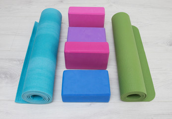 iyengar yoga props blocks, strap, roller and carpet