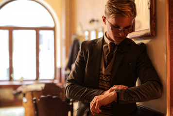 Elegant guy checking the time