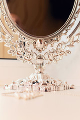 beautiful silver mirror on a dressing table