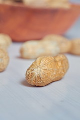 Peanuts in a brown bowl