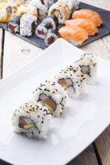 Salmon and caviar rolls served on a plate