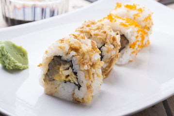 Salmon and caviar rolls served on a plate