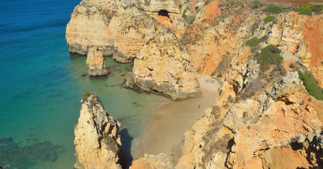 Sea cliffs and beach at Lagos Algarve Portugal
