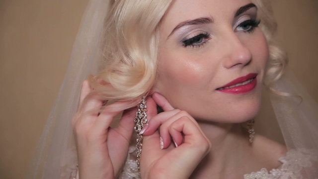 The bride wears a wedding earring