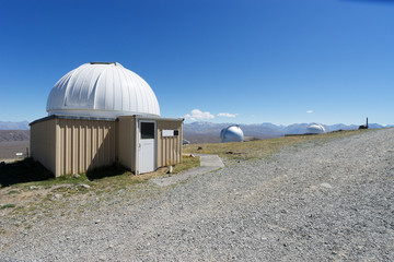 observatory on ground near lake in summer day in new zealand