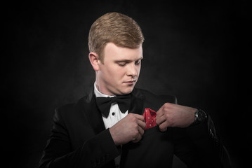 Young handsome man in black suit.